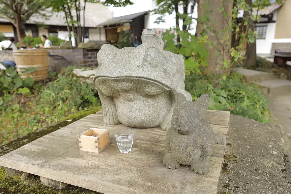 Snow-dusted stone jizō statues at Ouchijuku